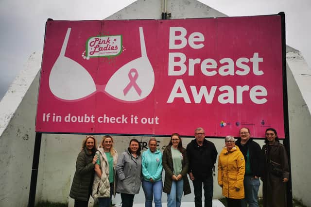 'If in doubt, check it out.' Members of the Pink Ladies Cancer Support Group pictured earlier this month at the sign erected at Free Derry Corner.