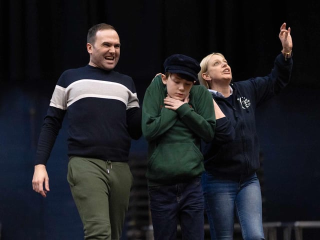 Mr and Mrs Sowerberry (Simon Quigg and Christine Baggley) with Oliver (David Langan) in LMS' production of Oliver! which runs in the Millennium Forum from March 20-23.