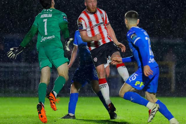 Liam Boyce heads past Waterford keeper Stephen McMullan. Photo: Kevin Moore/MCIphoto
