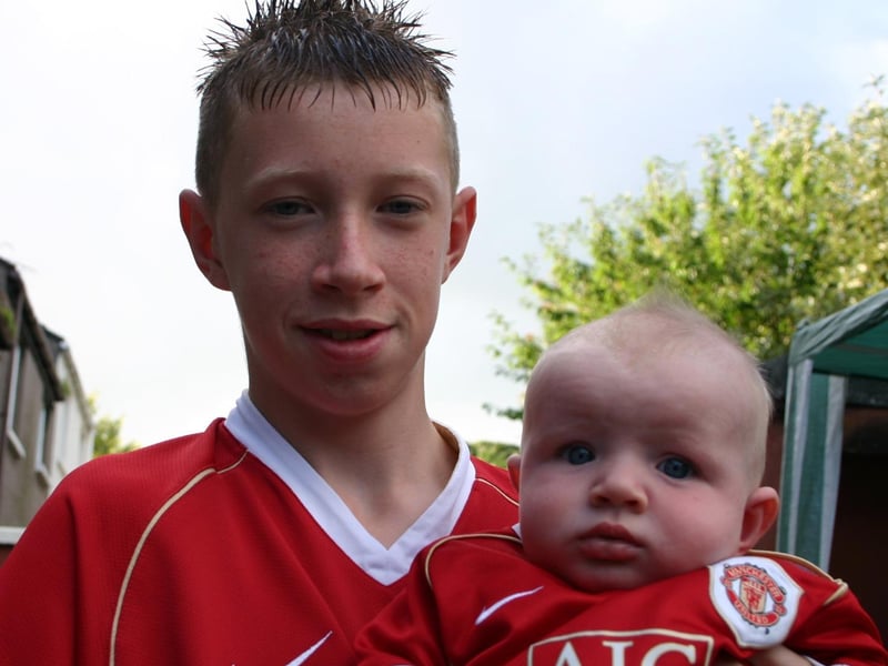 Damien with young brother Conal at the Bar- B- Q. 7429/DD : .