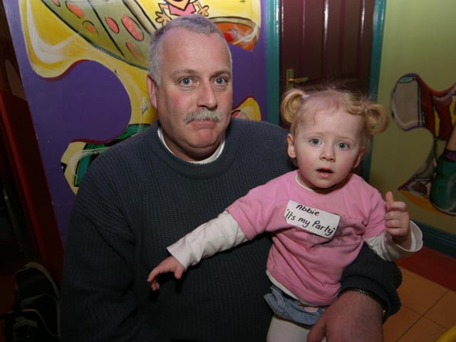 Abbie enjoys her birthday party with granda 'Chubby Alan' 0006/JML : Parties and celebrations January 2006: Abbie Simpson.