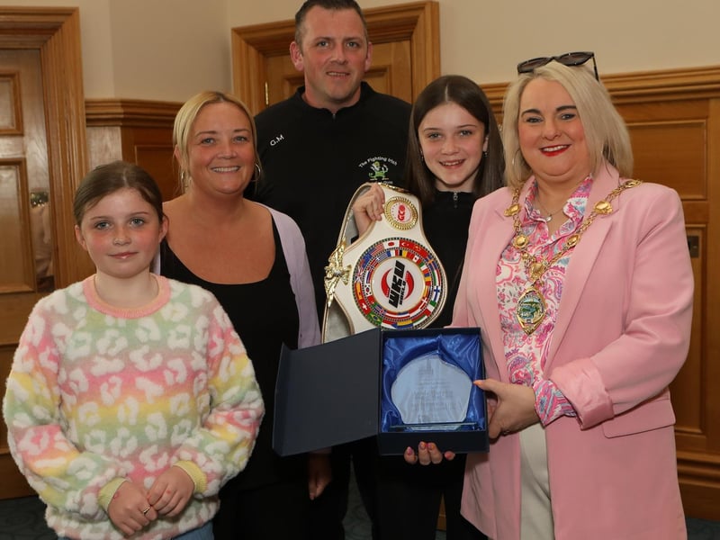 Annie Murphy civic reception 2 - Mayor Sandra Duffy makes a presentation to 13 years old Annie Murphy, winner of the WKU Pro-Am World Kick-boxing title at a civic reception held in the Mayor’s Parlour. Included are mum Michelle, dad Gareth and wee sister Charlene. (Photo - Tom Heaney, nwpresspics)