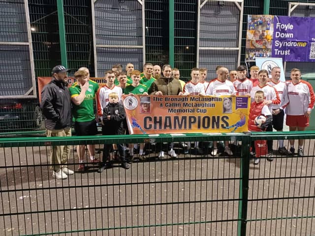 Derry City FC gaffer Ruaidhrí Higgins with players at the Galliagh Community Response Memorial Cup.