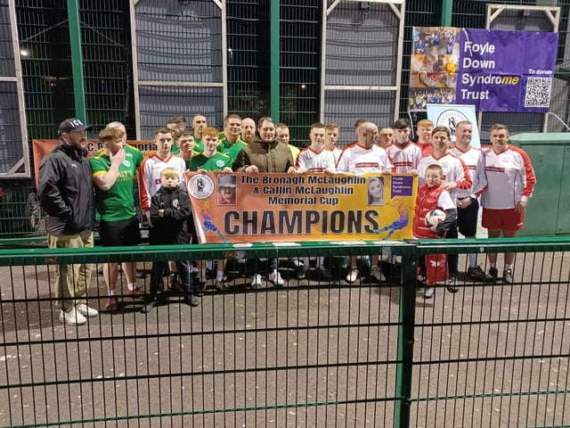 Derry City FC gaffer Ruaidhrí Higgins with players at the Galliagh Community Response Memorial Cup.