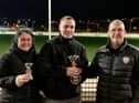 Clare and Nathan Coyle, representing Ciaran and John McLaughlin after 'Galliagh Black' was voted favourite performer at Nov 14th race meeting. Nathan is being presented with the Titanic Kennels Trophy by sponsor Jason Campbell (right). Greenfield Lark’s veteran winners' trophy was sponsored by Barry Holland.