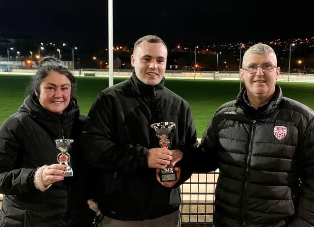Clare and Nathan Coyle, representing Ciaran and John McLaughlin after 'Galliagh Black' was voted favourite performer at Nov 14th race meeting. Nathan is being presented with the Titanic Kennels Trophy by sponsor Jason Campbell (right). Greenfield Lark’s veteran winners' trophy was sponsored by Barry Holland.
