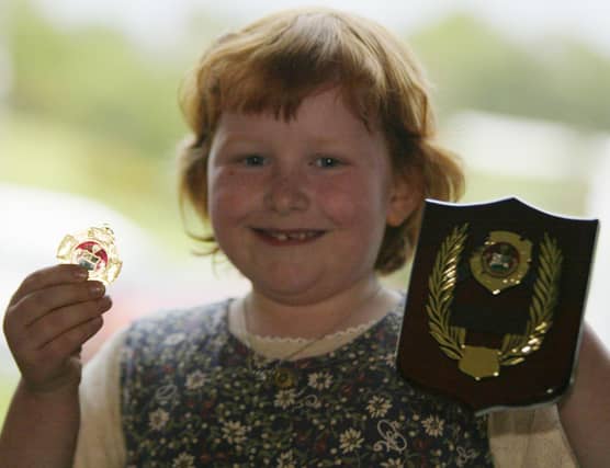 Siobhan O'Connor winner of the tin whistle under 8 and also the most promising player at Moville Feis. Siobhan is a student of the McClure School of Music. (1305JB08)