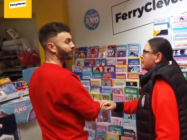Ferry Clever 'customer' Karen Pyne asking store owner if they have any Cups.