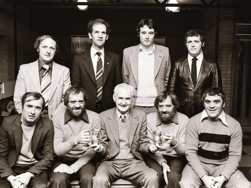 Chairman Jack McTaggart, centre, handing over special presentations of inscribed tankards to Ciaran Coyle, secretary, on left, and Sean Coyle, games organiser, a tribute from the committee for their work for the association at the D&D FA presentations. Also in the group are the committee members, Eamon Friel, treasurer, seated left, Jim Crossan, vice-chairman, seated on right, with standing, from left, Keith Harris, Billy Nelis, Tom McDermott and Brendan Fleming.