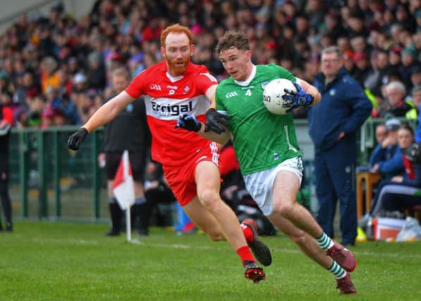 Derry’s Conor Glass battles with Limerick’s Barry Colman during their Division Two game at Owenbeg on Saturday afternoon. P4105GS –