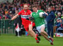 Derry’s Conor Glass battles with Limerick’s Barry Colman during their Division Two game at Owenbeg on Saturday afternoon. P4105GS – 