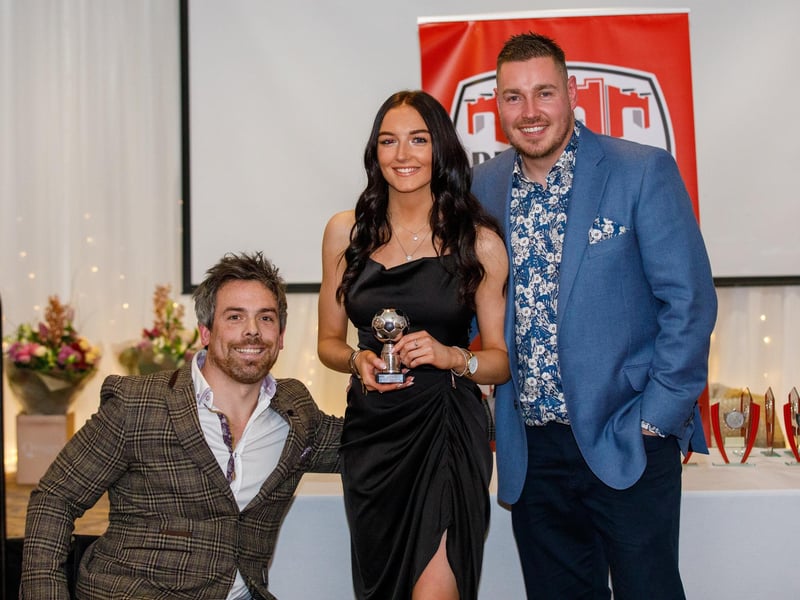 Shania McMonagle receiving her goal of the season award from manager Paul Dixon and coach Pete Mitchell.