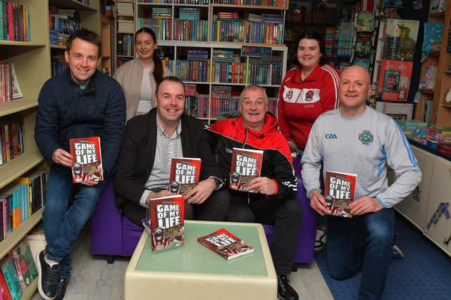 Journalist Michael McMullan pictured with Emmet Thompson, Bláthnaid McElholm, Diarmuid McElholm, Sean McErlean and Aine McElholm at the launch of his new Derry GAA Book ‘Game of my Life’, in the Little Acorn Book Store, on Saturday morning. Photo: George Sweeney