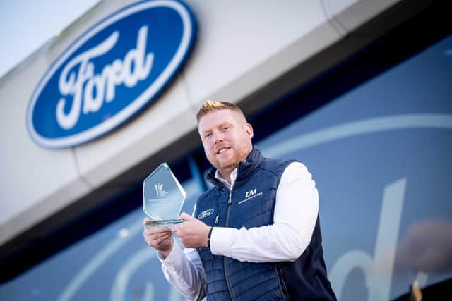 Jonathan Ferguson, Ford Sales Manager at Desmond Motors, pictured with the Ford Building Together Award at Desmond Motors’ Strand Road dealership in Derry, following the dealership’s success at the 2026 Ford Dealer Marketing Awards.