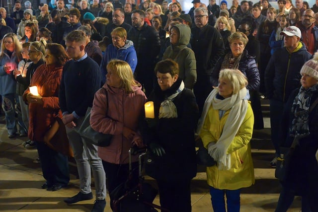 Some of the attendance at a candlelit vigil, held at Guildhall Square on Monday evening, to remember those who died in the Creeslough tragedy on Friday afternoon last.  Photo: George Sweeney.  DER2241GS – 54