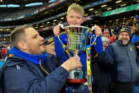 Hugh McGrath celebrates Steelstown's historic All Ireland Intermediate Club victory with his nephew Hugh Hetherington in Croke Park last February. (Photo: George Sweeney.)