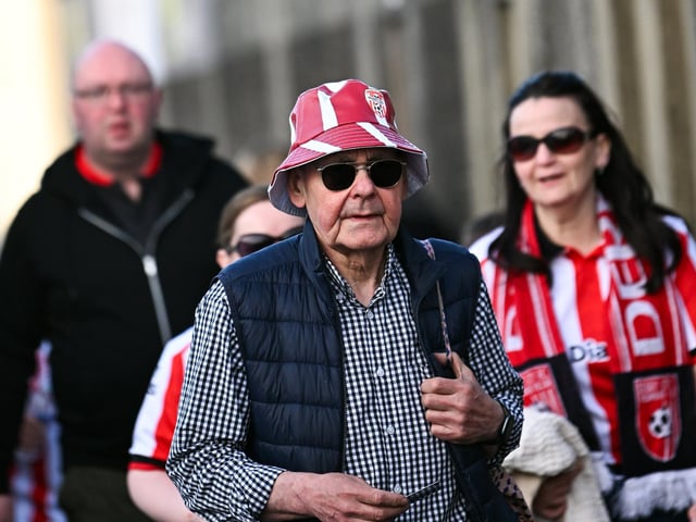 Derry City supporters on their way to the ground before the SSE Airtricity Men's Premier Division match between Derry City and Shamrock Rovers at Find Insurance Celtic Park in Derry. Photo by Ramsey Cardy/Sportsfile