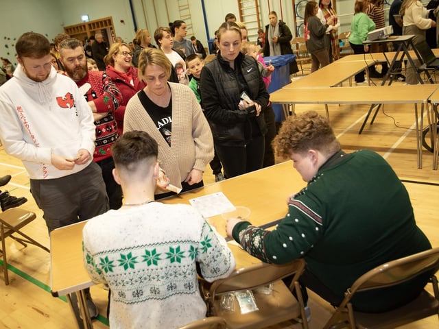 Ticket sellers get the ball rolling at the Wheel of Fortune in St. Joseph's Boys School.