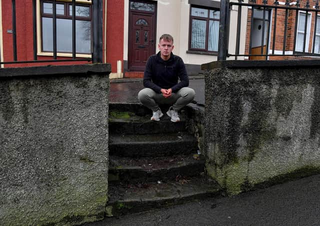 Sinn Fein MLA Padraig Delargy pictured beside dilapidated steps leading to homes in Stewart’s Terrace and Keer’s Terrace on Creggan Road. Photo: George Sweeney. DER2311GS – 23