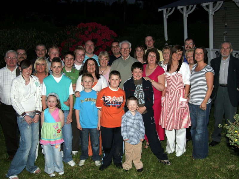Tom McGil M.B.E, centre, celebtrates with his family on receiving the M.B.E. 0623JML