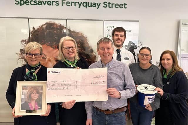 Specsavers Derry staff with the cheque for the Foyle Hospice. The staff raised funds in memory of their beloved former colleague Michelle Morrison.