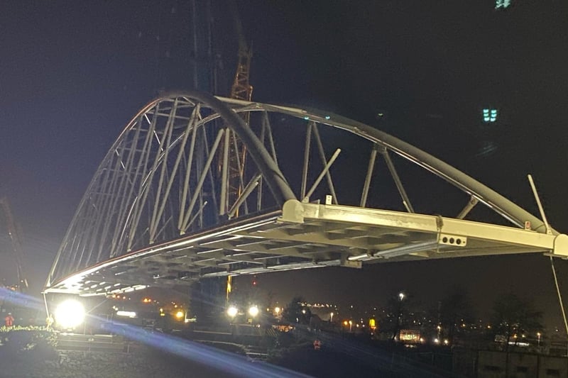 The Pennyburn foot and cycle bridge was officially set in place by contractor, FP McCann Ltd, last night. This is a key stage in the project which will see the the bridge and greenway link to Bay Road Park open to the public later in the Spring. The project is funded by the INTERREG VA Programme, administered by the Special EU Programmes Body and the Department for Communities.