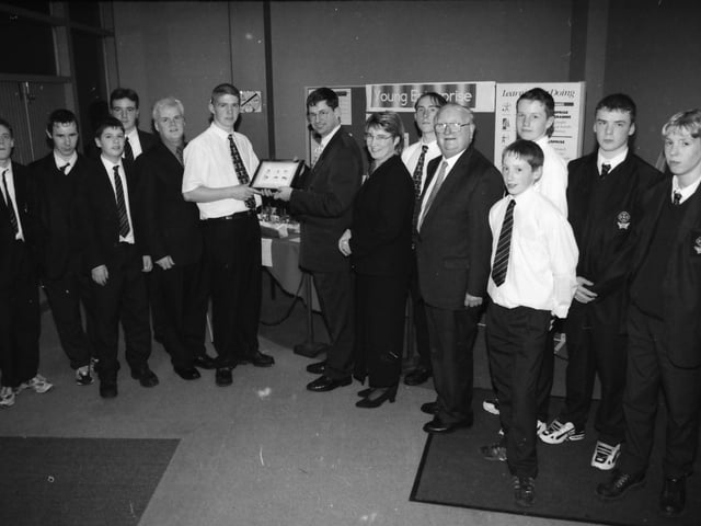 Mark Loughrey, presenting a Young Enterprise product to Éamon Ó Cuív (Arts Minister), guest speaker at the St. Peter's prizegiving.