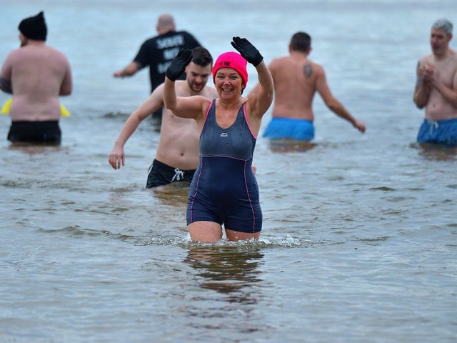 Enjoying the annual ARC Fitness New Year's Day Charity Swim at Lisfannon beach. Photo: George Sweeney. DER2301GS 06