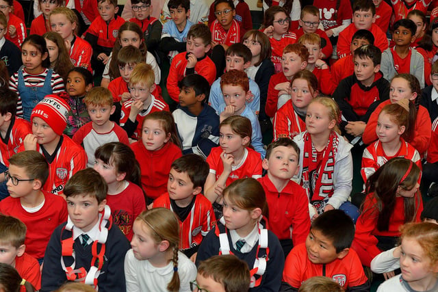 Pupils from Good Shepherd Primary School gave a rapturous welcome to Derry City players Mark Connolly, Liam Mullan and Jack Lemoignan during a visit to the school, with the FAI Cup, on Friday afternoon. Photo: George Sweeney. DER2247GS – 79