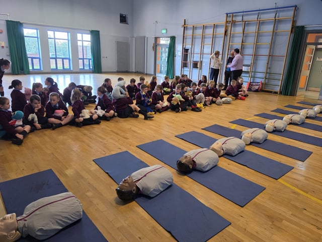 Heart of Foyle volunteers providing Basic Life Support sessions at St Eithne's Primary School.