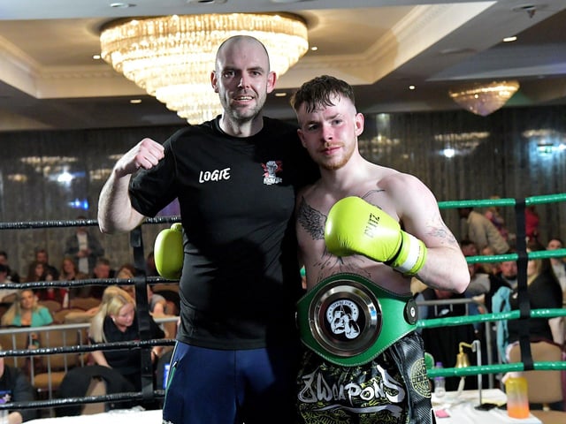 Kickfit’s Ciaran O’Neill pictured with his trainer Aodhan Logue after his win over Cameron Smyth, Urban KB, on Saturday evening last in the Everglades Hotel. Photo: George Sweeney.  DER2312GS – 07