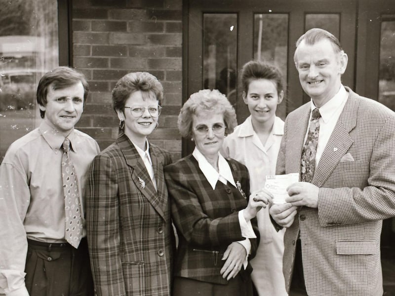 The Devine family making a donation to the Foyle Hospice.