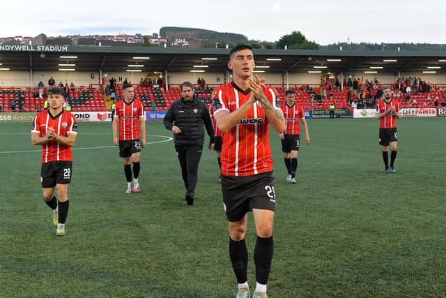 Derry City manager Ruaidhri Higgins and his players leave the pitch after the game against Shelbourne on Friday night. Photo: George Sweeney. DER2321GS - 87