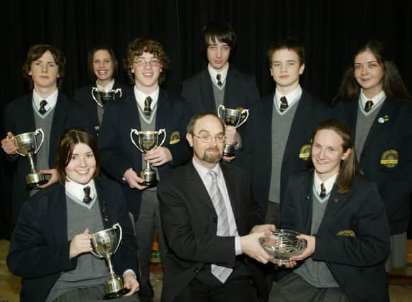 Year 11 prizewinners pictured with Mr Pat O'Doherty.  Seated are Eleanor Coyle, Mr O'Doherty and Therese Devine.  Standing are Ryan McCloskey, Christine Forbes, Brendan Coyle, Liam Eastwood, Geoffrey Simpson and Mairead McGilloway.  (1001JB23)