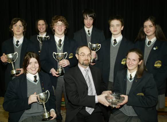 Year 11 prizewinners pictured with Mr Pat O'Doherty. Seated are Eleanor Coyle, Mr O'Doherty and Therese Devine. Standing are Ryan McCloskey, Christine Forbes, Brendan Coyle, Liam Eastwood, Geoffrey Simpson and Mairead McGilloway. (1001JB23)