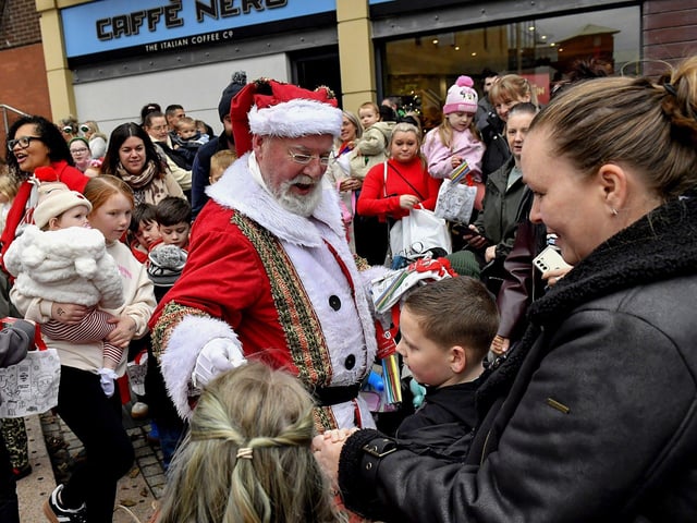 Santa arrives at the Richmond Shopping Centre on Sunday afternoon. Photo: George Sweeney