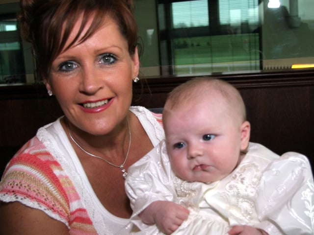 Proud grandmother Bernie smile for the camera with baby Shanice 0170JML : Parties and celebrations April 2006: Shanice Devine.