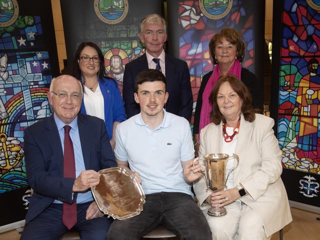 Eoin Plower, receiving the Laureates’ Prize and PPU Prize and Monsignor Coulter Award for Mathematics and Science from Mr. P. Kelly and Mrs. G. Canavan, Board of Governors. At back from left are Mrs. C McLaughlin, Principal, Mr Niall Downey, Guest Speaker and Mrs. M. Hamilton, Board of Governors.