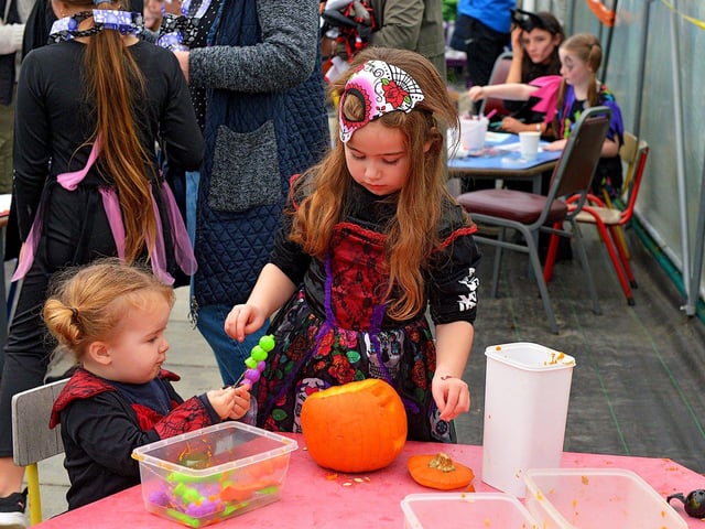 Pumpkin carving at the Mullan Hope Centre’s Spooky Halloween Markets, in Moville, on Sunday evening last. Photo: George Sweeney. DER2244GS – 054