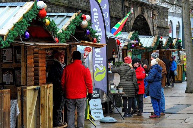People visiting the Christmas Market in Guildhall Square on Friday afternoon. Photo: George Sweeney. DER2250GS – 61