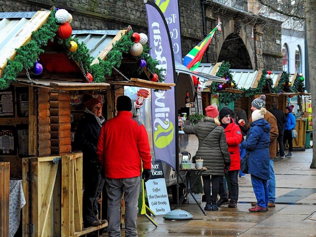 People visiting the Christmas Market in Guildhall Square on Friday afternoon. Photo: George Sweeney. DER2250GS – 61