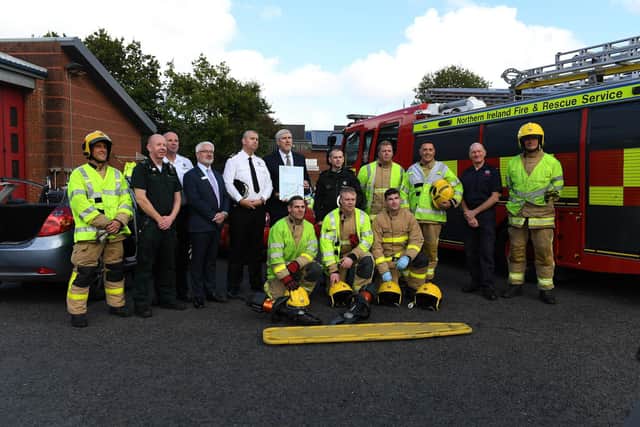 John O’Dowd , Minister for Infrastructure, pictured with members of the emergency services during the launch of the Department for Infrastructure’s Road Safety Strategy for Northern Ireland to 2030 and the 2024/2025 Action Plan at the NIFRS western area headquarters on Crescetr Link on Thursday afternoon. Photo: George Sweeney