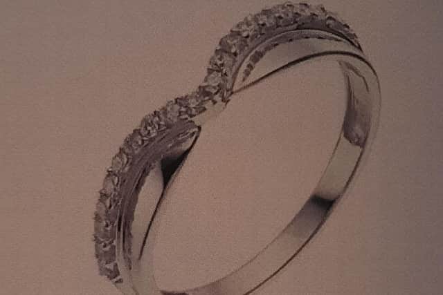 The second ring is described as white gold in a wishbone shape with a number of set small stones.