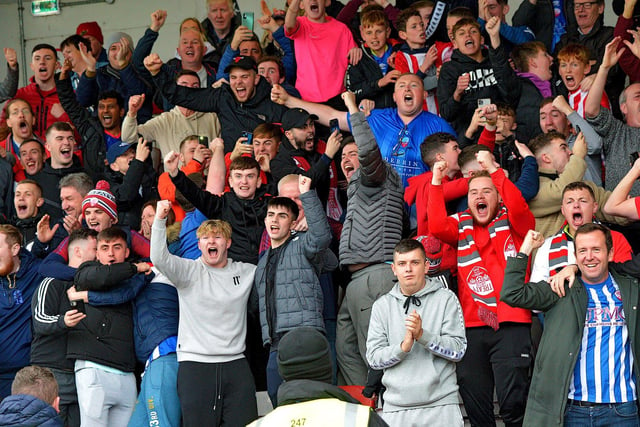 Treaty United fans celebrate Enda Curran's penalty, which pulled a goal back against Derry City, on Sunday afternoon. Picture by George Sweeney. DER2241GS – 042