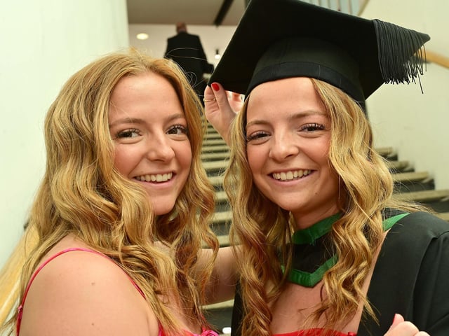 Twin sisters Molly McKee and Katie McKee celebrating at Ulster University Derry graduations as Molly graduates in BSc (Hons) Sport, Physical Activity and Health.