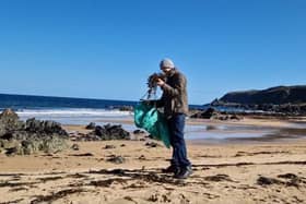 Collecting seaweed on the shore.