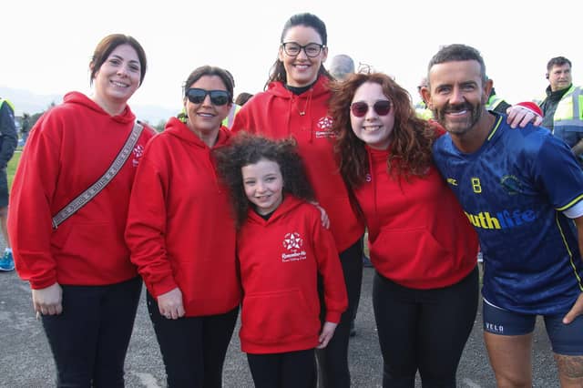 Louise James and her daughter Rioghnach pictured with Micky Doherty and a group of volunteers at The 10th Anniversary 5K Walk in memory of their family who were tragically killed at Buncrana Pier. (Photo - Deirdre Heaney, nwpresspics) : Buncrana Pier Tragedy 10th Anniversary Remembrance Walk. Photos: Deirdre Heaney, nwpresspics.