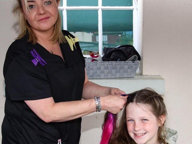 Professional hairdresser, Edwina braiding Clodagh hair at the Family Fun Day held in Longtower School playground. (Photo - Deirdre Heaney, nwpresspics)