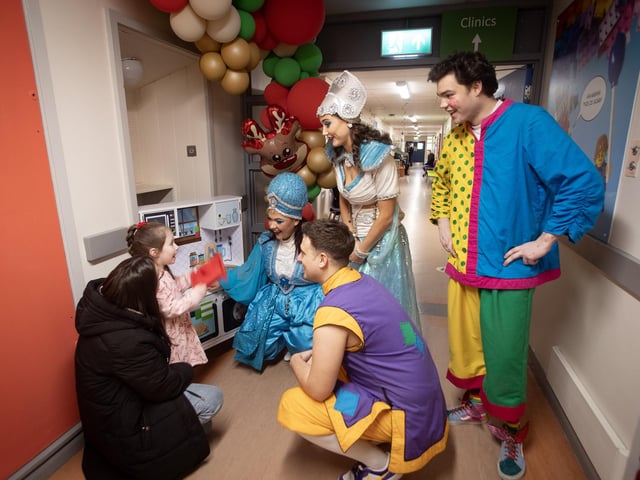 Characters from 'Aladdin' the 2024 Christmas Pantomime at the Millennium Forum pictured on a visit to the Children's Ward at Altnagelvin Hospital on Thursday afternoon. They are pictured with 4 years old Mia Grumley and her mum.