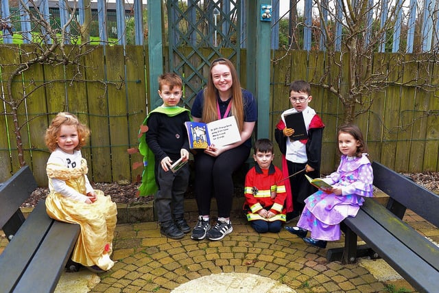 Miss Laura celebrates World Book Day with Orla, Everett, Rory, Tom and at Belmont Nursery School on Racecourse Road. Photo: George Sweeney. DER2310GS – 28